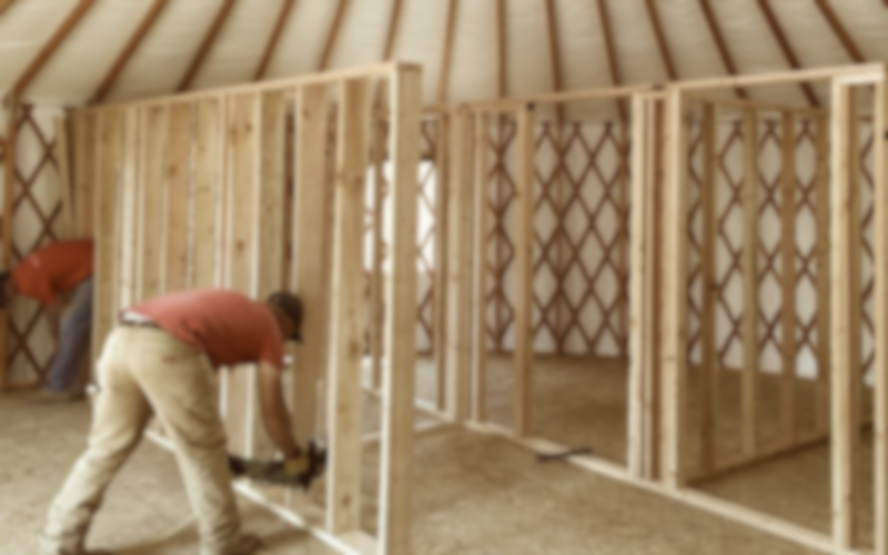 Escalante-Yurts-Our-Story-two-men-building-yurt-interior 2